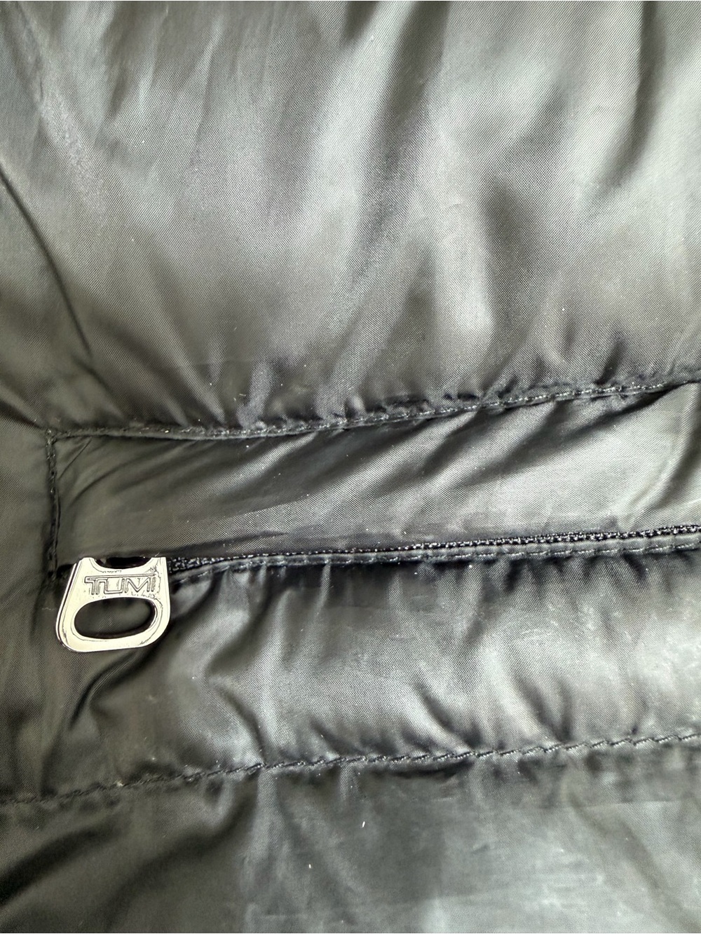 TumiPAX McLaren Packable Black Puffer Vest/Pillow with Orange Trim - Picture 3 of 12